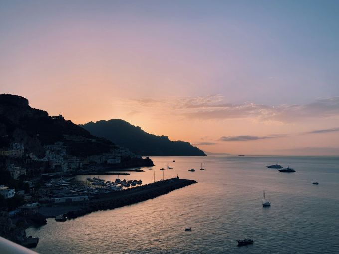 view of amalfi in the night from the boat 