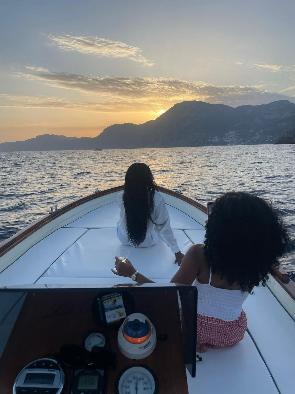 view of amalfi in the night from the boat 